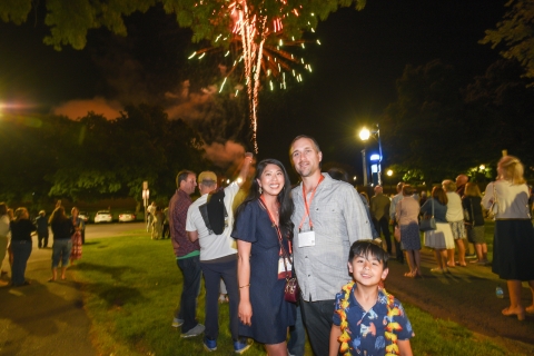 A Bucknell family poses under the fireworks.