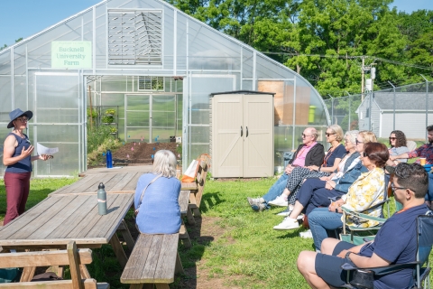 Farm and Garden Manager Jen Partica speaks to a group of alumni on Reunion Weekend.