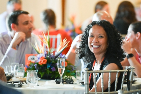 Patty Bouasanouvong Stewart '99, P'27 smiles during a dinner event