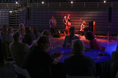 A jazz band performs for alumni.