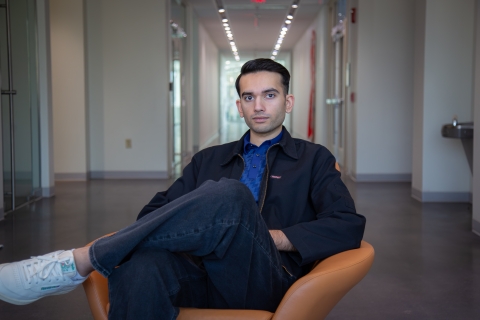 Farhaj Shahid '26 - Finalist $1,500 -  Bison Match , Sitting on a chair in the hallway