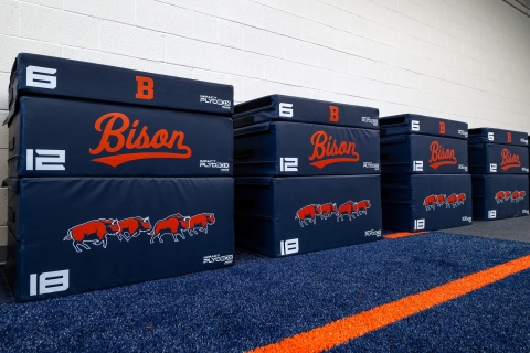 Navy blue plyo boxes feature Bison athletics branding