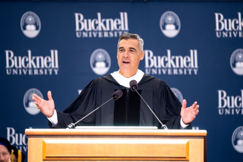 Jay Wright speaks behind the podium on stage at Bucknell&#039;s 173rd Commencement