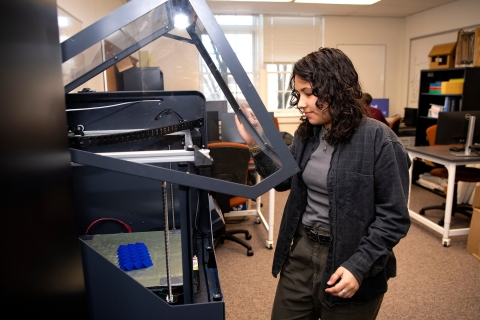 Iona Pitkin operates engineering equipment in Dana lab.
