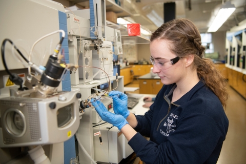April Hurlock '23 uses lab equipment