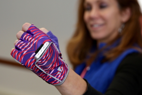 Runlites, a woman wearing a glove with lights