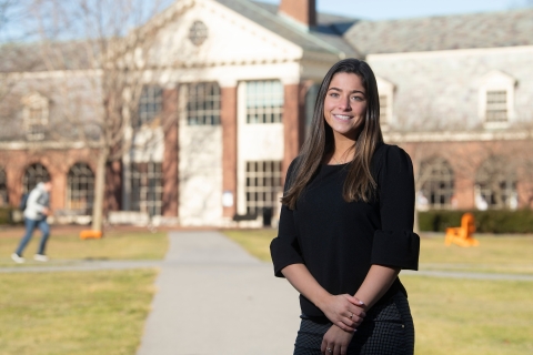 Emma Cashwell stands in front of building