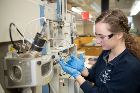 April Hurlock Uses Lab Equipment