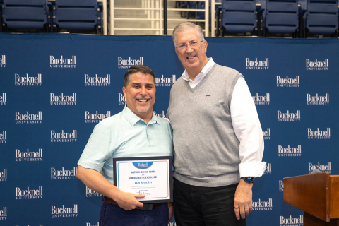Tim Kracker stands next to President John Bravman