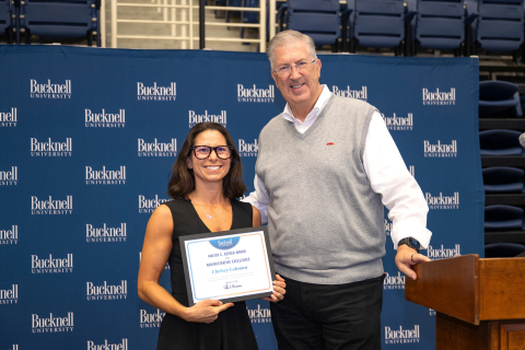 Chelsey Lehman stands next to President John Bravman
