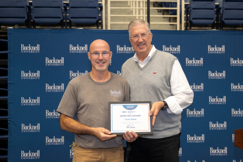 Scott Kline stands next to President John Bravman