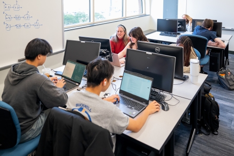 Students sitting at computers in The High Performance Computing Lab (Located in Academic East building in room 116)