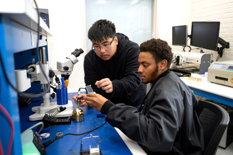 Two students work in a makerspace together.
