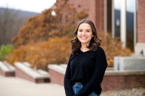 A student stands on the Quad