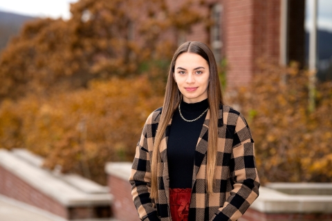 A student stands on the Quad