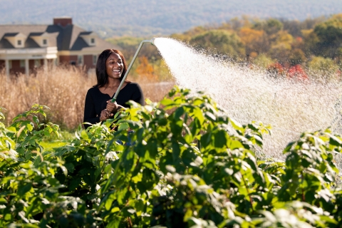 Maya Asante '24 waters crops