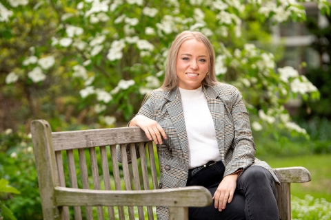 Sara Butler sits on a bench on Bucknell&#039;s campus.