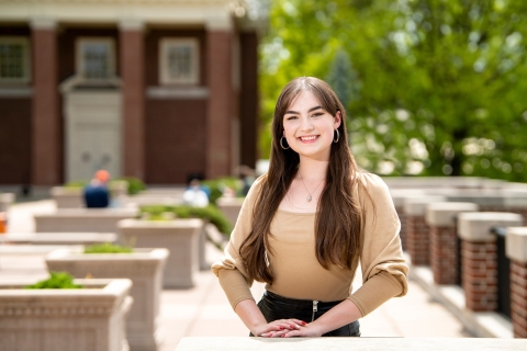 Susie Williams stands on the Quad