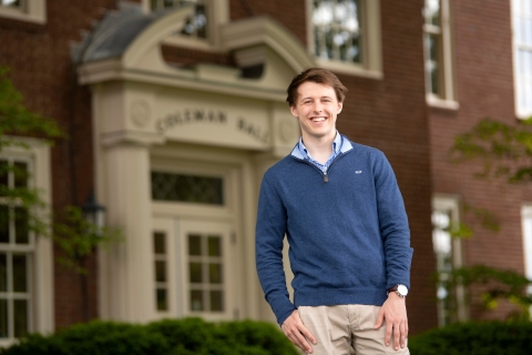 Will Snyder '21 poses outside in front of building