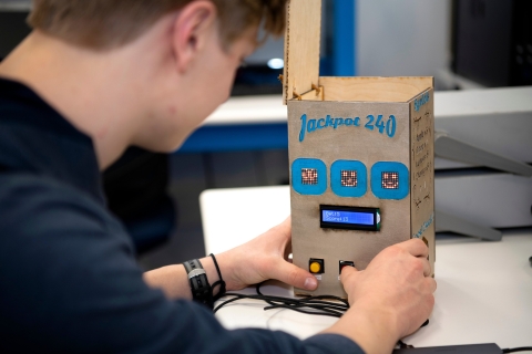 Jack Casturo '24 tinkers with hand-made slot machine