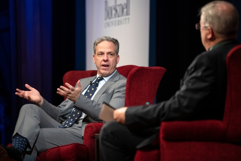 Jake Tapper speaks on stage at the Bucknell Forum