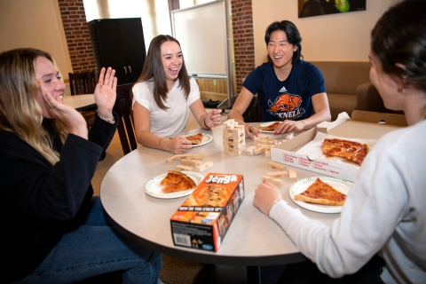 Natalia Mancero '24 enjoys pizza and Jenga with hallmates