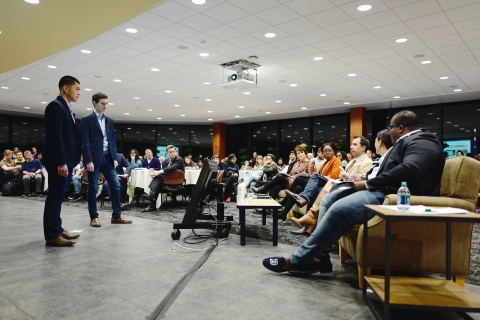 Two student pitch their ideas to a panel of judges at BizPitch
