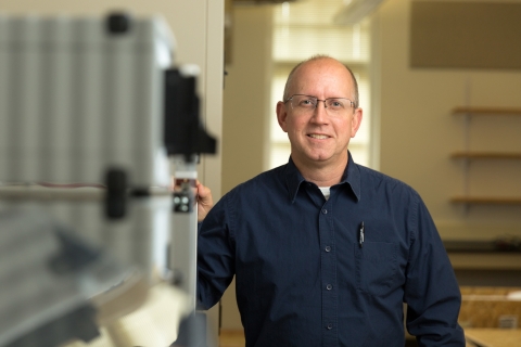 Professor standing in engineering lab