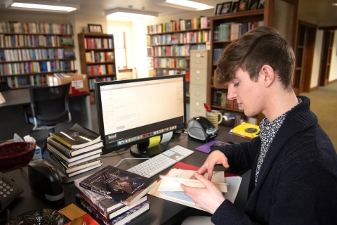 Student reading in the library