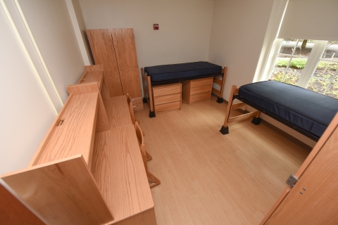 An empty two student dorm room