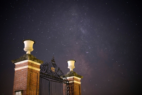 The Christy Mathewson Gate in front of a starry night sky
