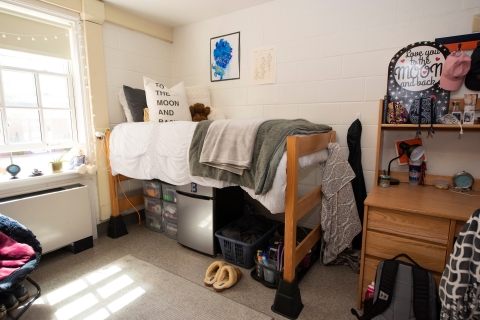 A Bucknell University decorate dorm room bed with risers.