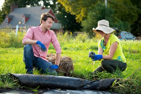 Two people working in the campus garden