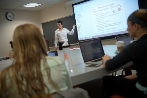 Professor teaches business to a class