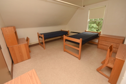 Empty double dorm inside Larison Hall