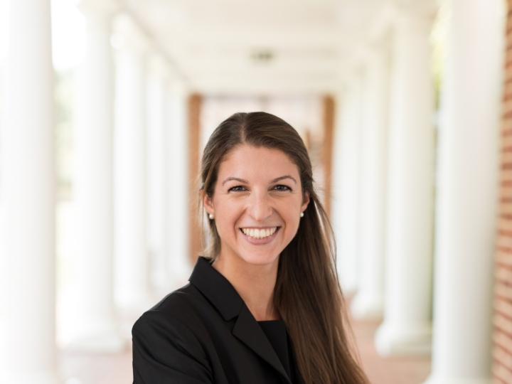 Rachel Gibson poses under a colonnade on the University of Virginia campus