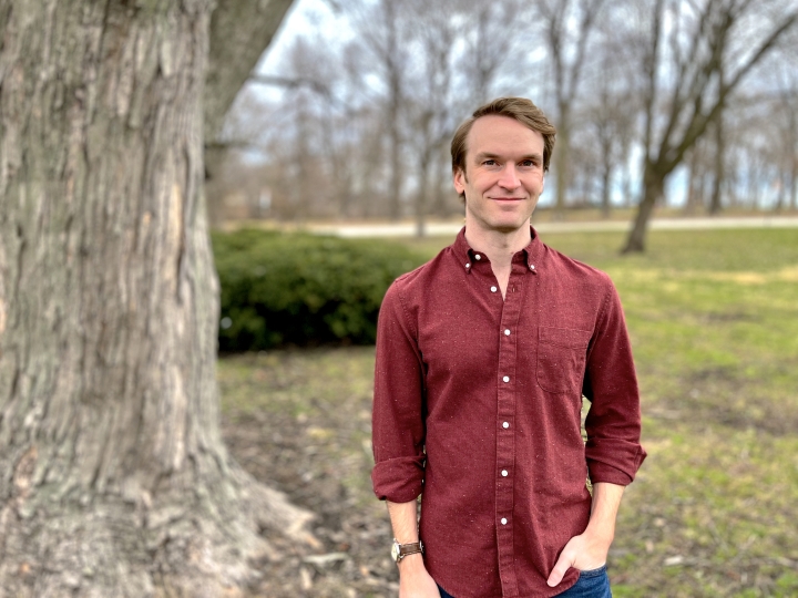 Portrait of Matt Kandler outside near a tree.