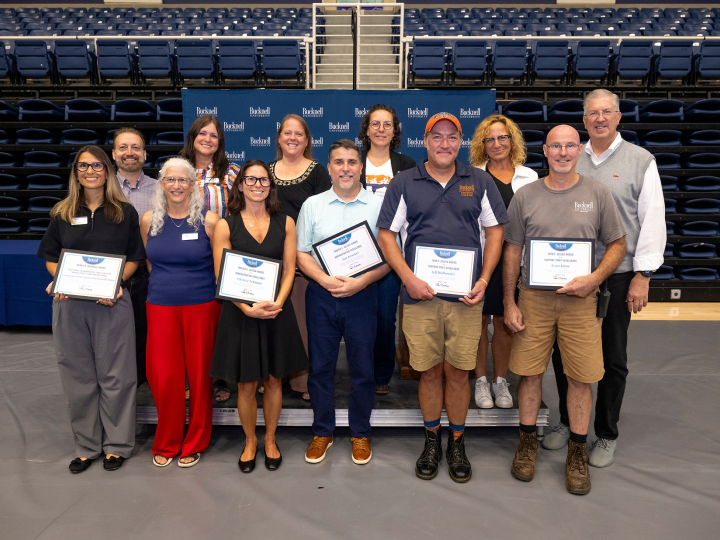 A group of Bucknellians stand together after receiving awards.