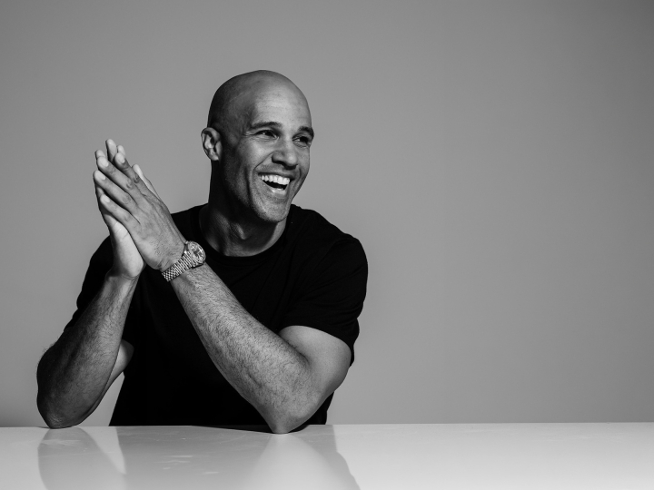 Mark Tallman smiles in this black and white image.