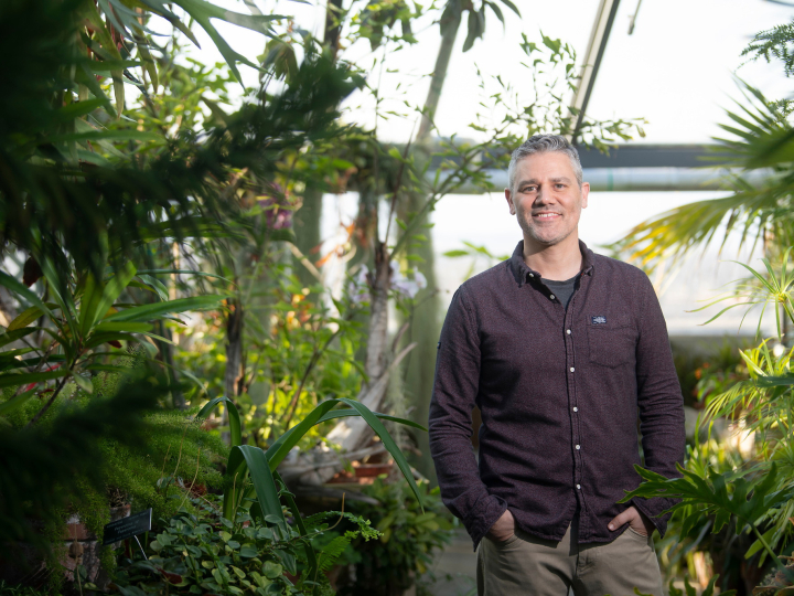 Portrait of Professor Mark Haussmann inside the Rooke Science Greenhouse