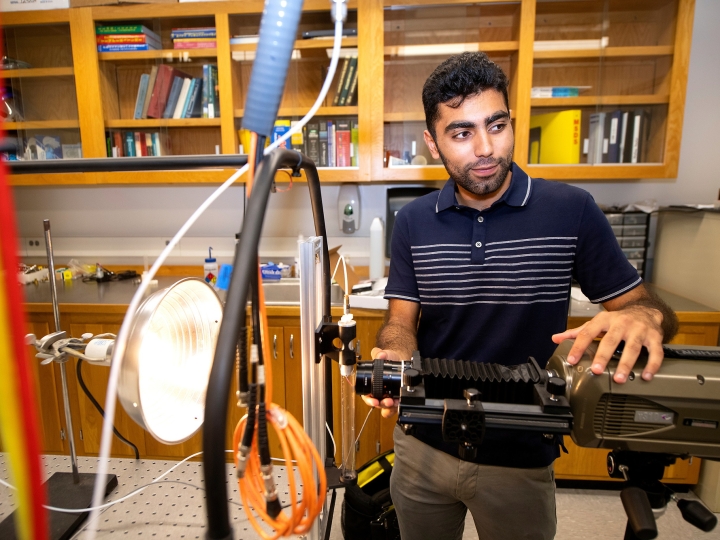 Abdullah Nabi in a mechanical engineering lab with research equipment