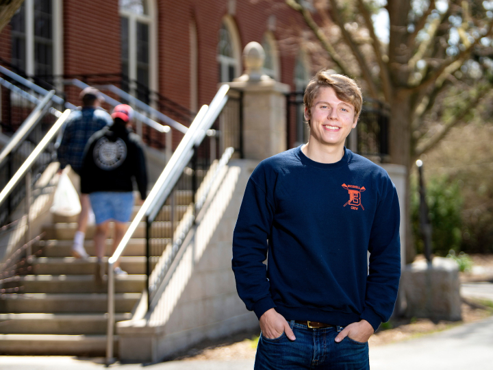 Philip Onffroy stands outside the entrance to Dana Engineering Building
