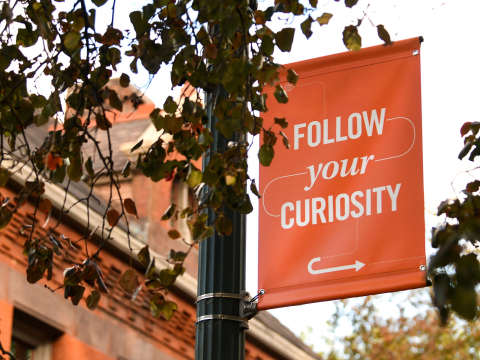 Follow Your Curiosity banner on campus