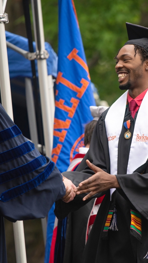 Graduate receiving diploma