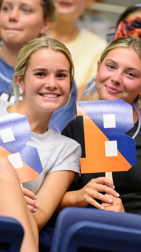 'ray Bucknell, students holding Bsigns
