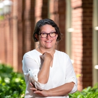 Portrait of Virginia Zimmerman outside of a brick building.