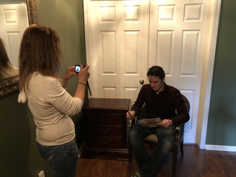 Camillo Lazarczyk '21's mother films him reading.