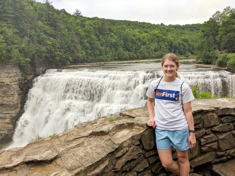 Portrait of Jordan Collins in front of waterfall