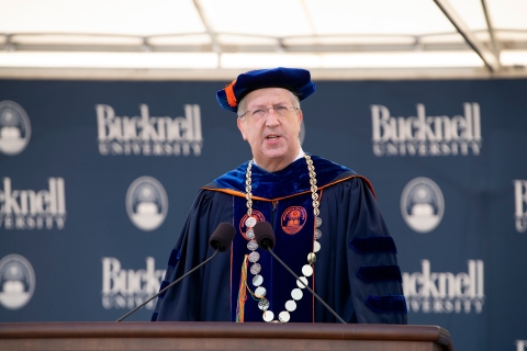 President John Bravman addresses the graduates