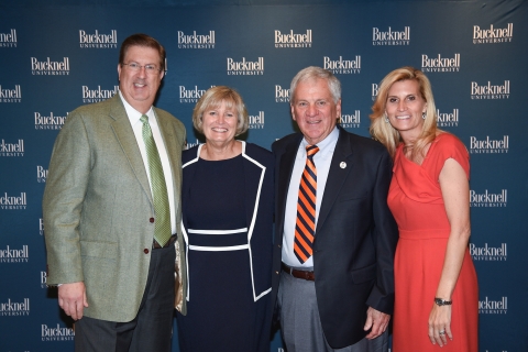 The alumni award winners with President Bravman